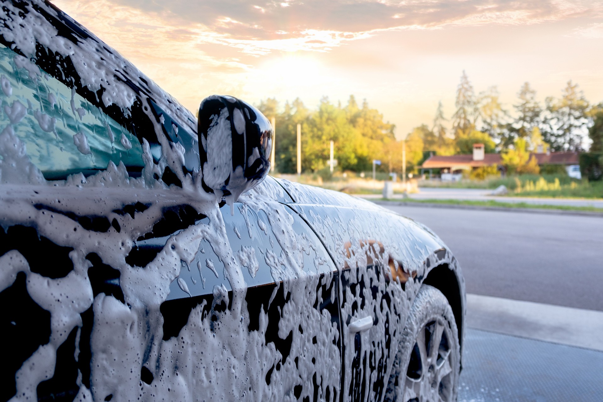Car wash. Close-up car is in the active foam.